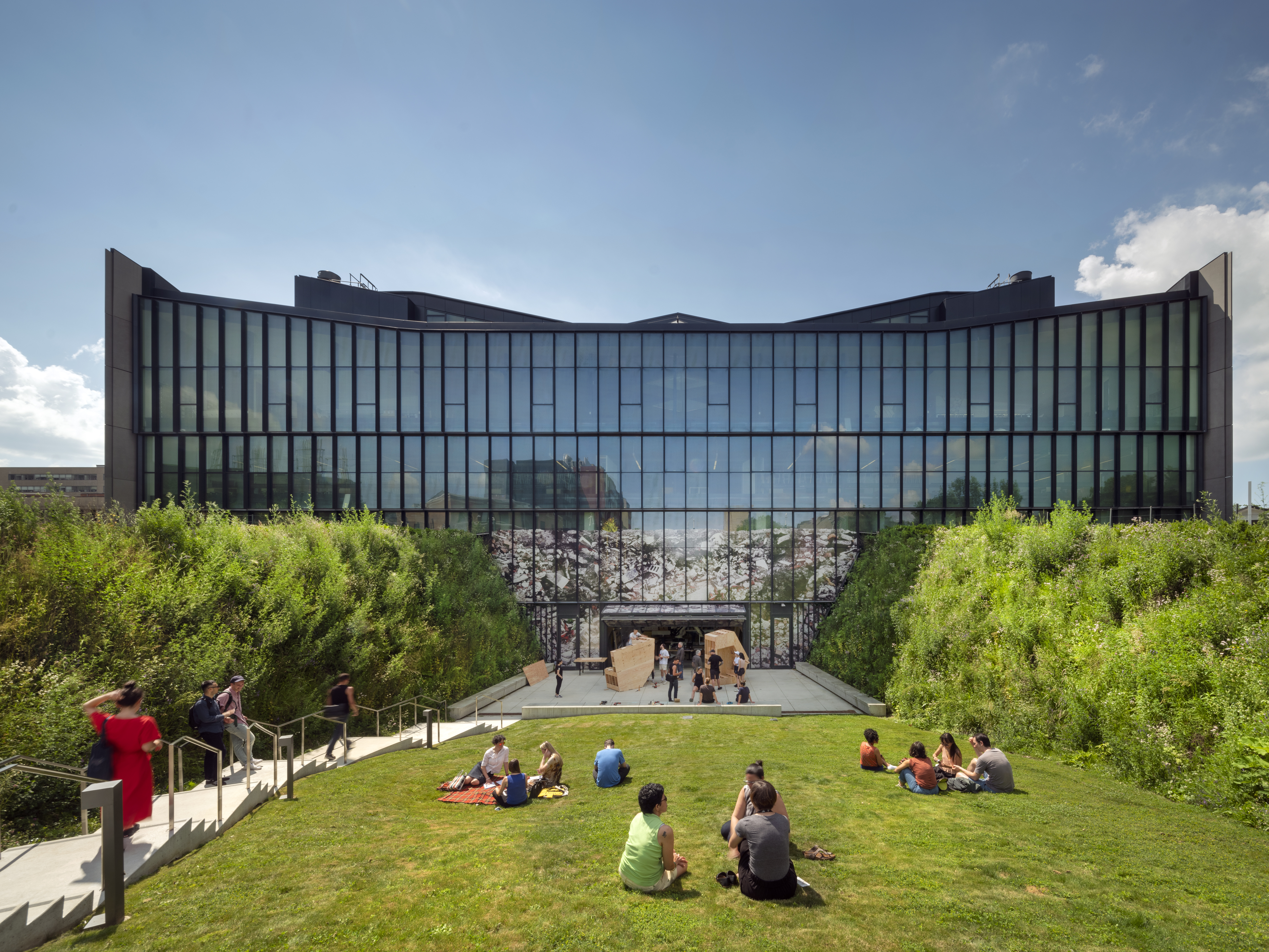 north view of daniels building with students on the grass