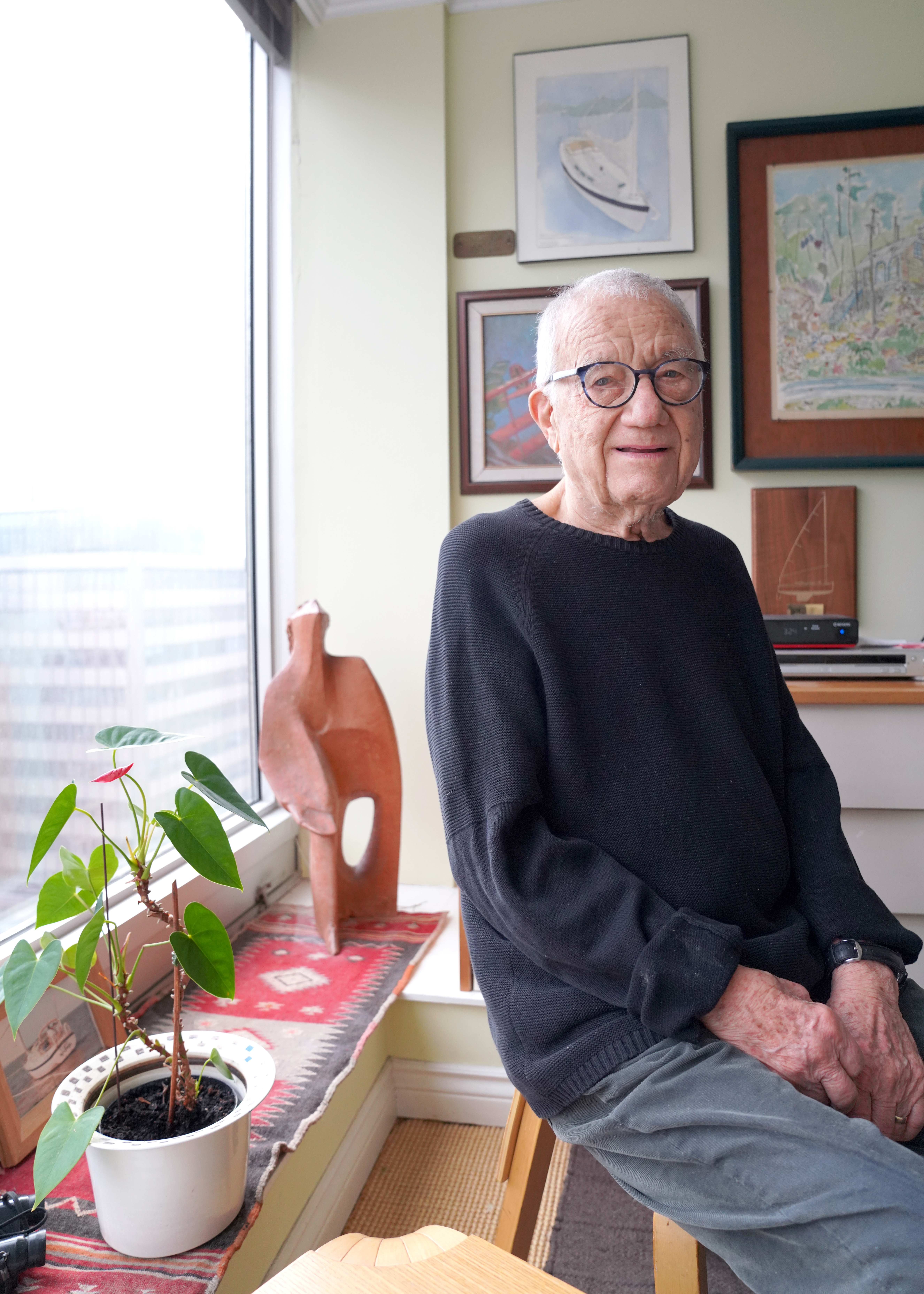 photo of Jerome Markson (older white gentleman) sitting on a chair beside a window.